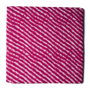 Pink and white printed cotton fabric with leheriya print